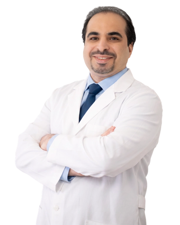 Professional headshot of Dr. wearing a white lab coat, smiling at the camera against a black background. This is a standard medical professional portrait used for clinic or practice identification.